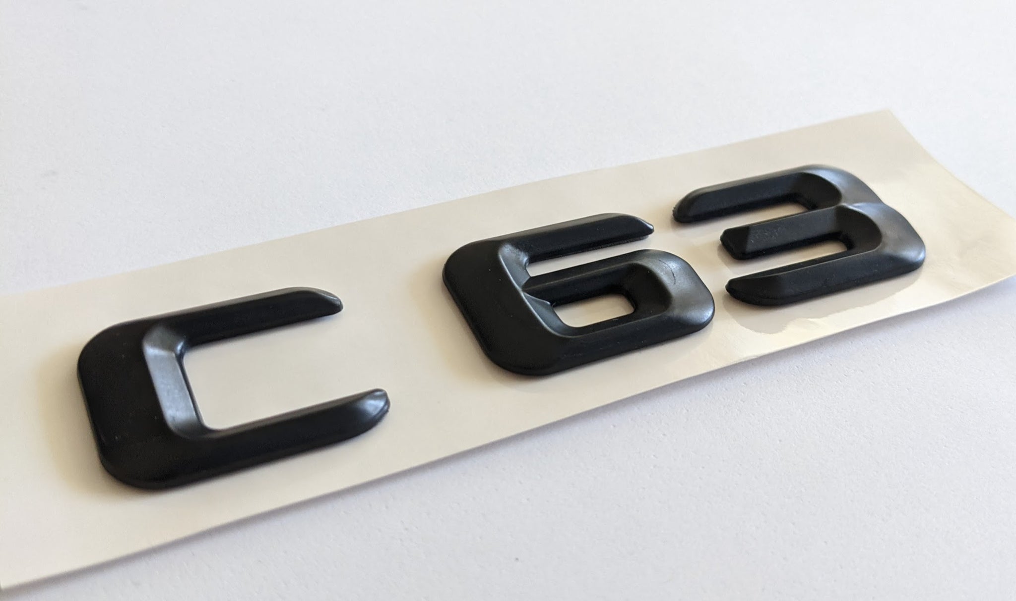 thumbnail image 2 of New Mercedes-Benz C63 AMG Rear Boot Badge – Matt Black, OEM Style 2 of 6